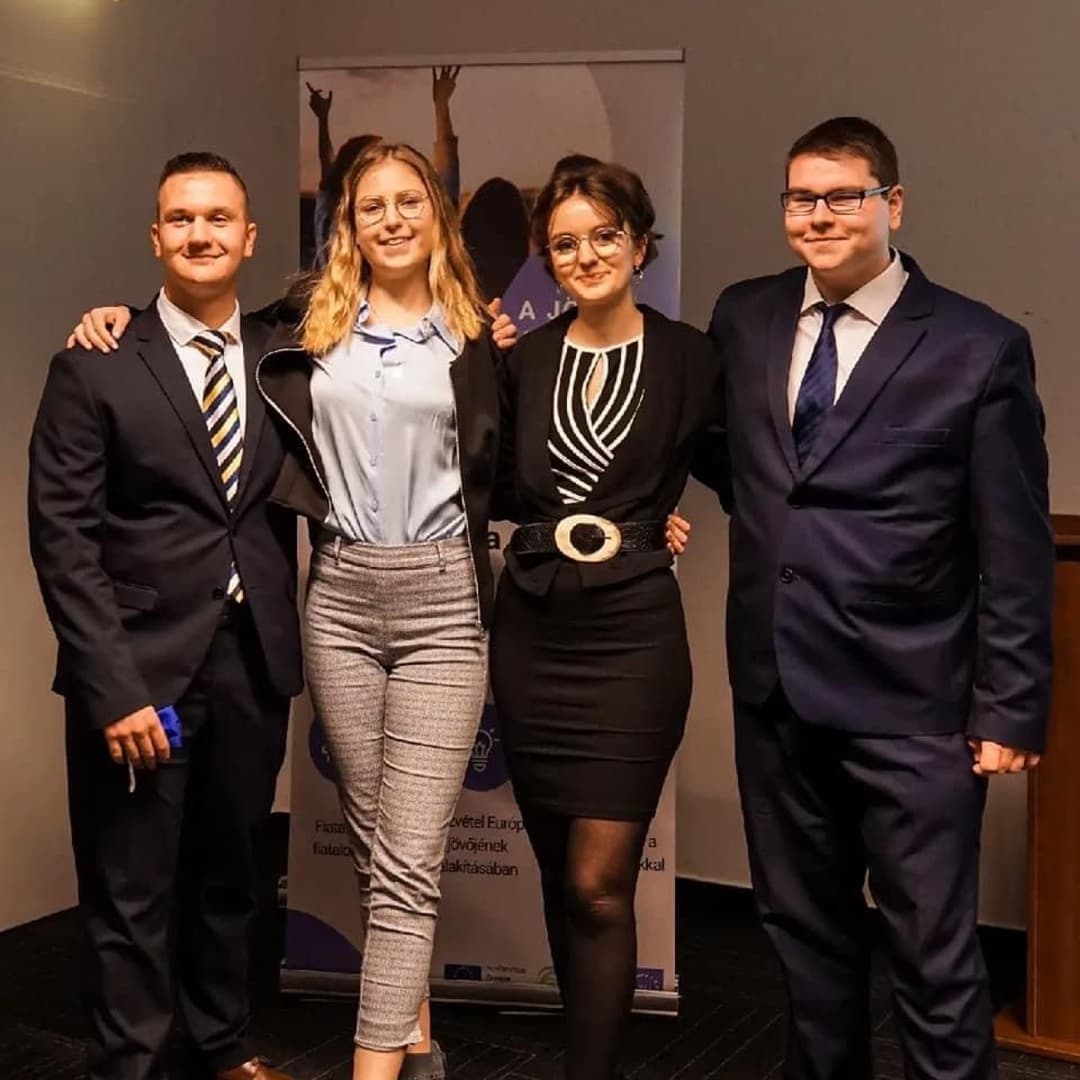 Young policy club organizers standing together at an EU-backed event