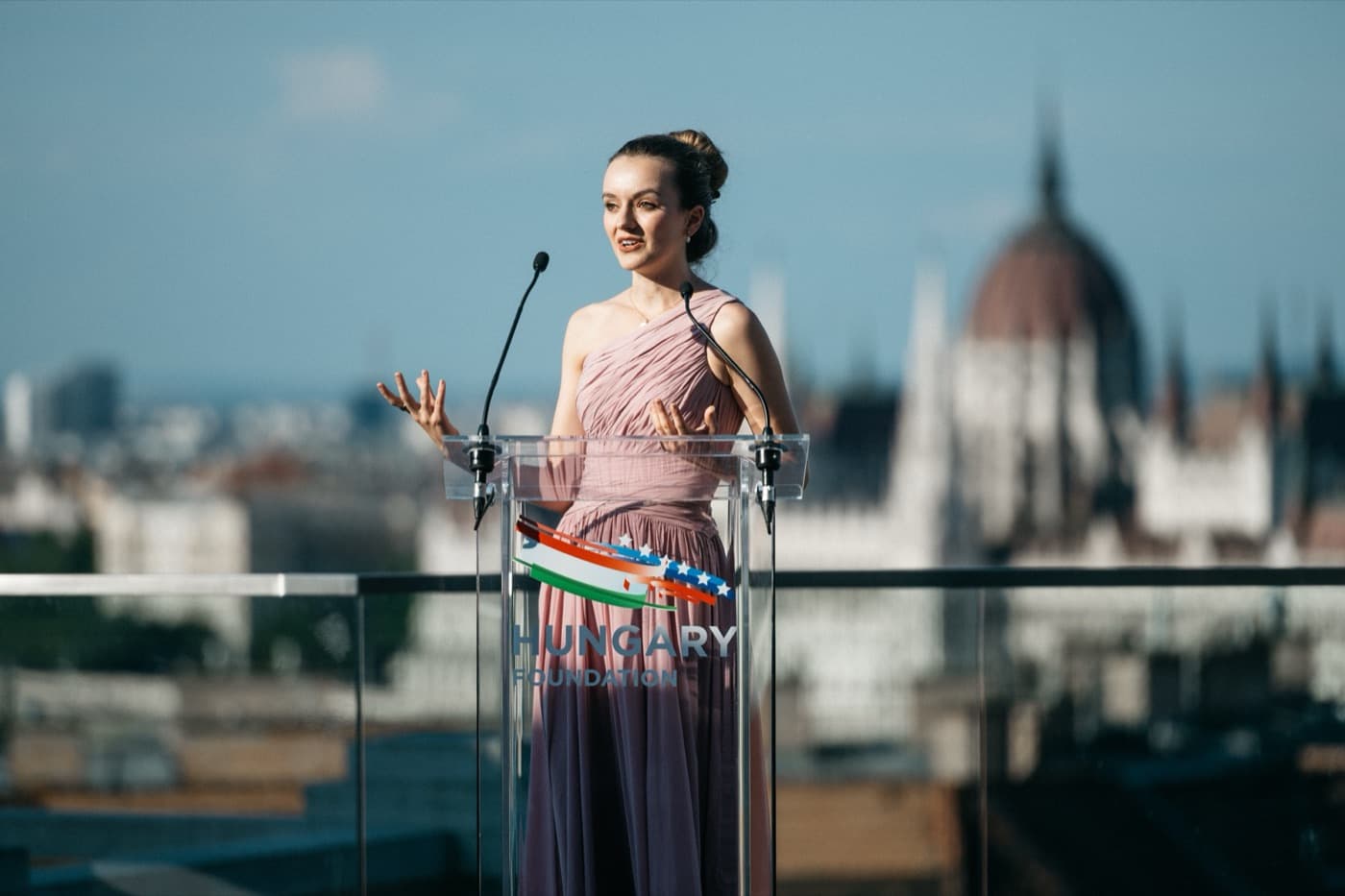 Recent portrait of Annamaria speaking at a podium